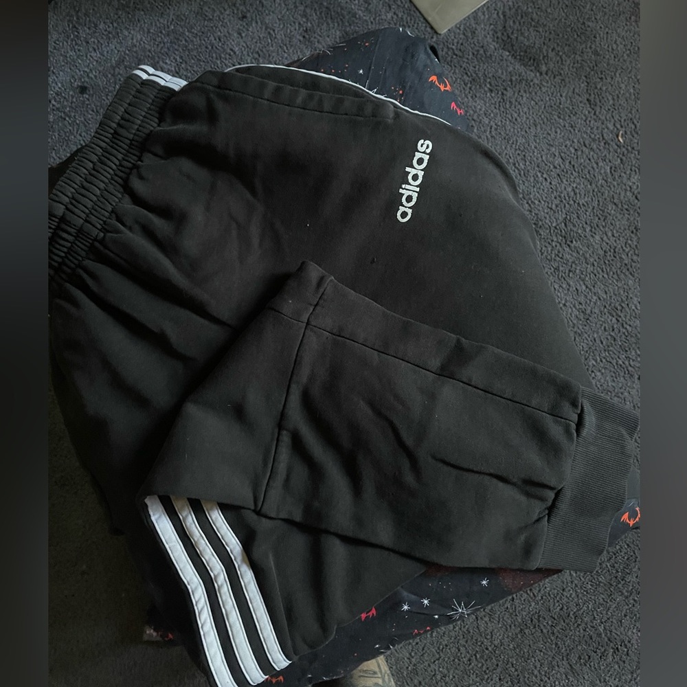 Black and white striped adidas sweats
